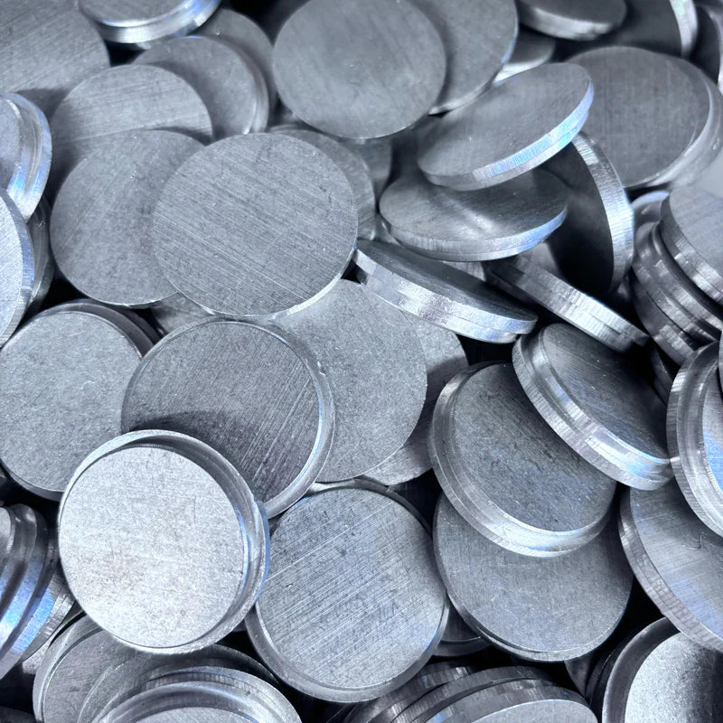 Stack of round aluminum end caps