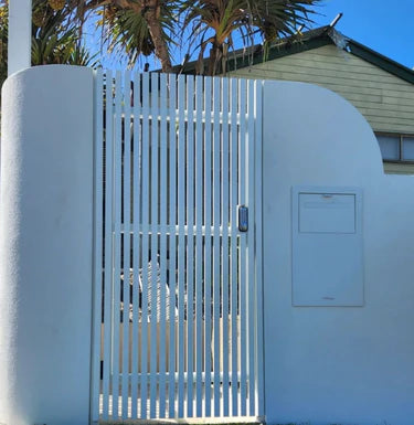 White aluminum gate with ends secured with aluminum end caps