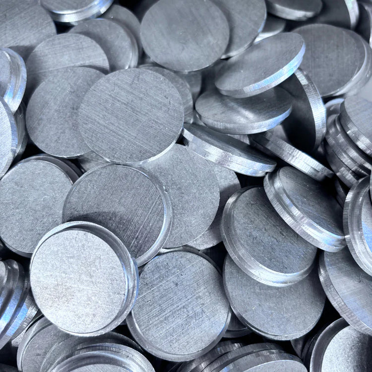 Stack of round aluminum end caps