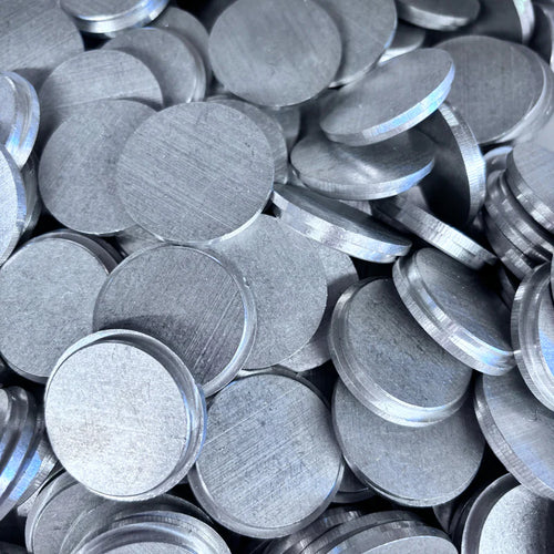 Stack of round aluminum end caps